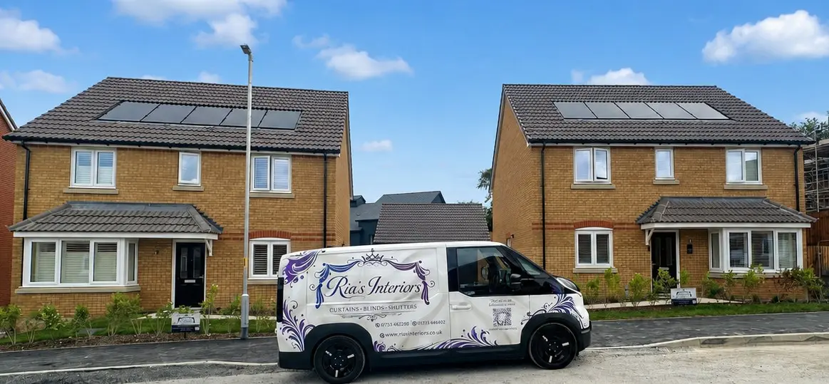 Ria's Interiors van outside new build homes with fitted shutters and blinds