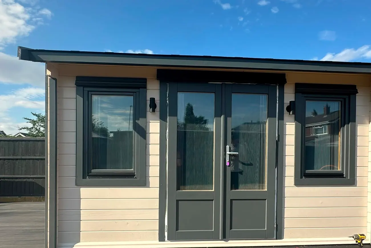 Garden room exterior with BlindScreen blinds fitted to the windows and French doors