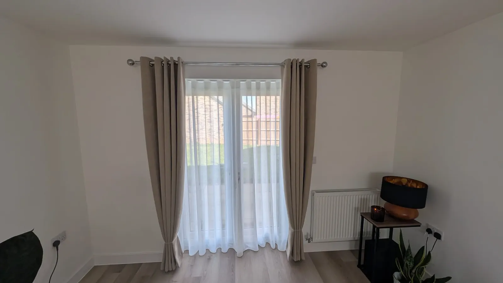Curtains layered over sheer curtains at the same French doors