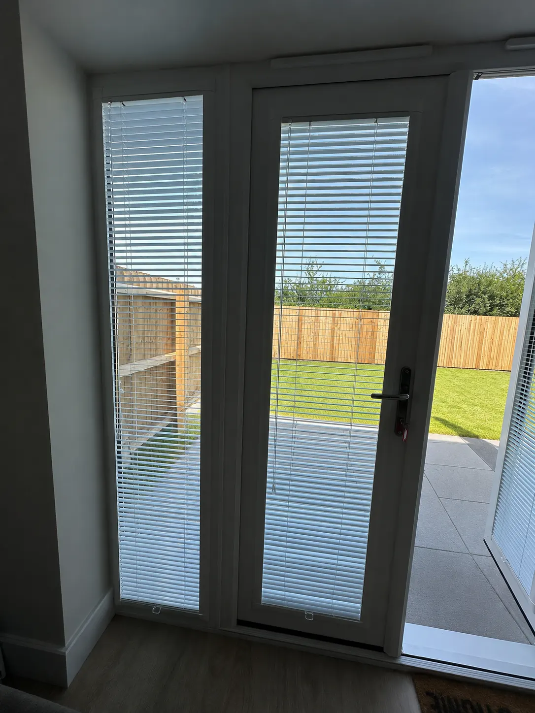 Perfect Fit blind staying attached to an open French door