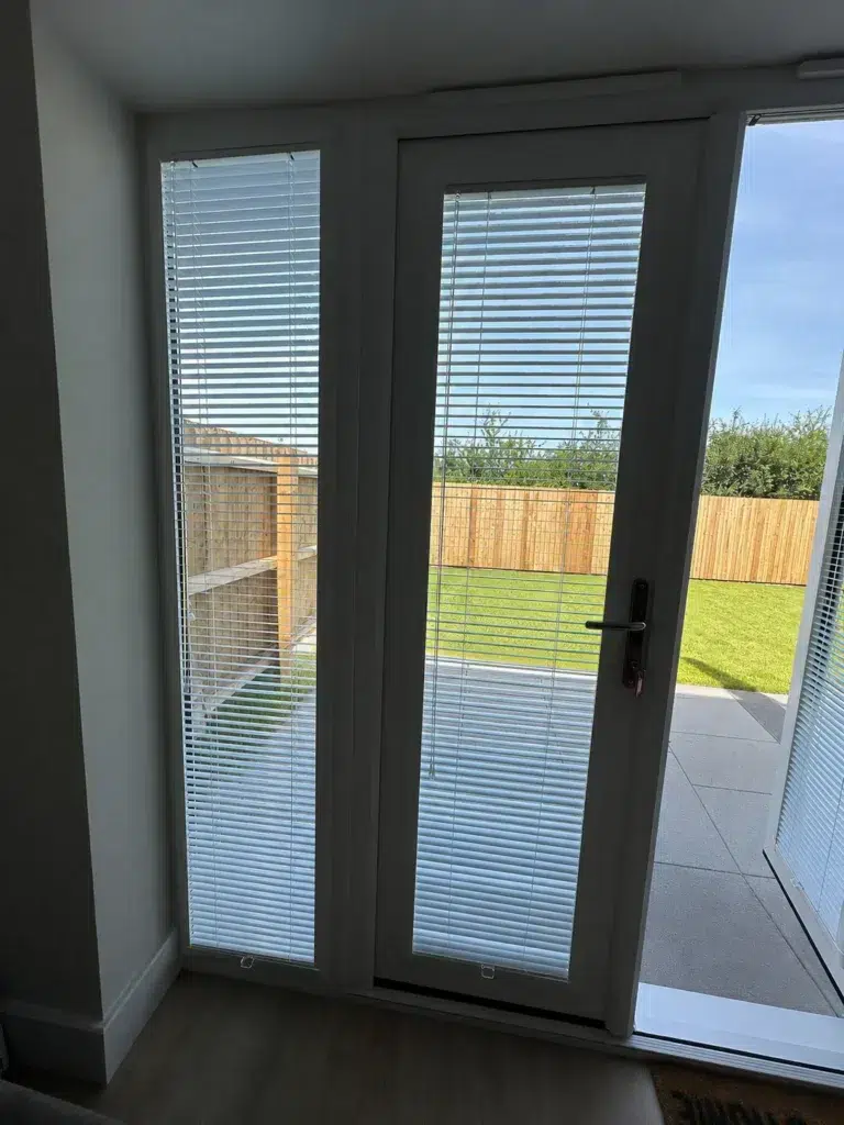 Perfect Fit blinds on new-build French doors, standing open to the garden