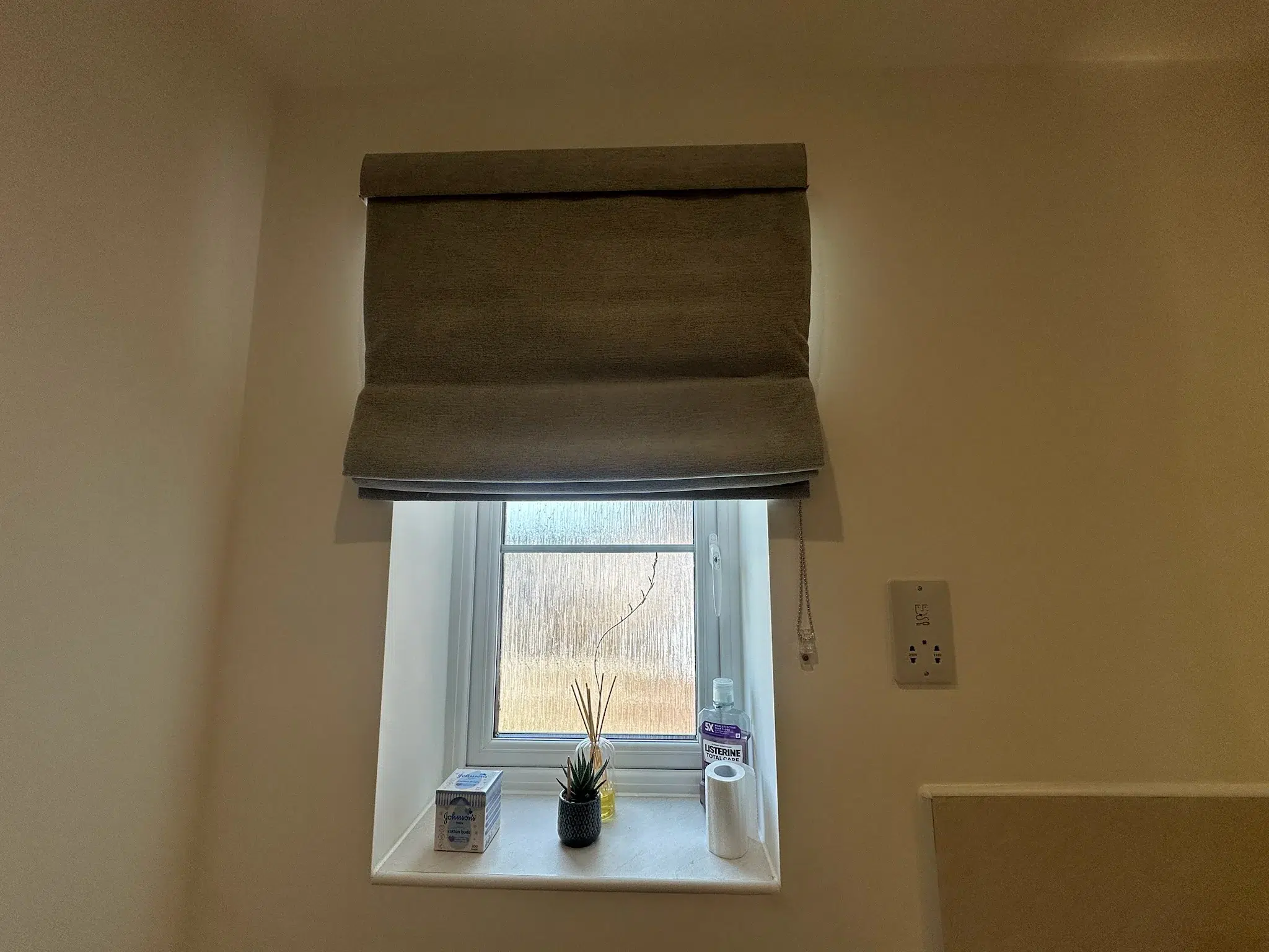 A made-to-measure Roman blind fitted in a bathroom