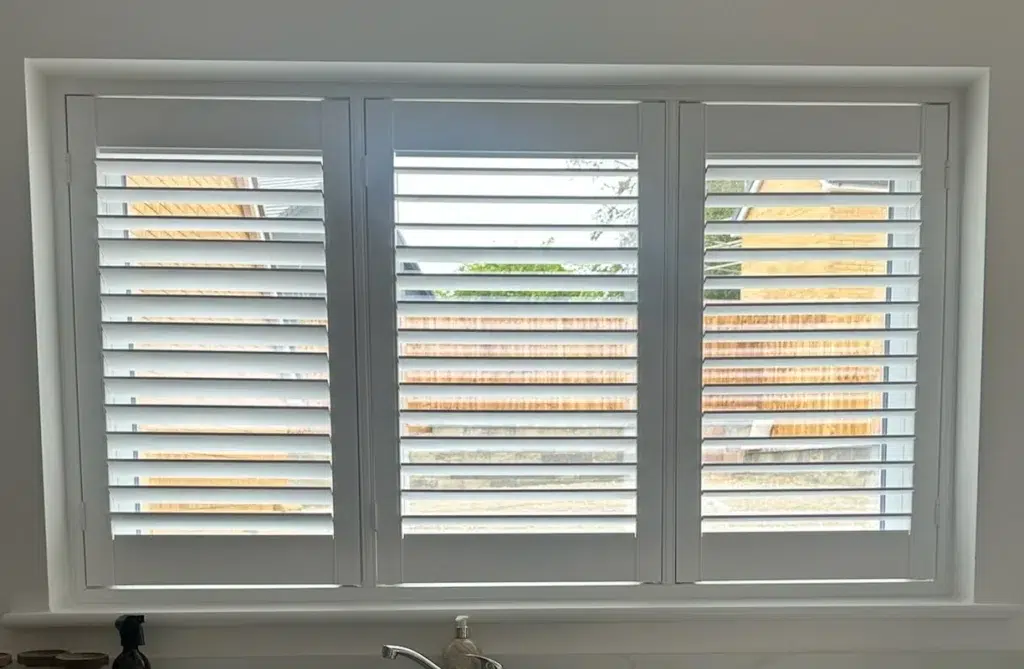 White UK-made shutters fitted in a kitchen