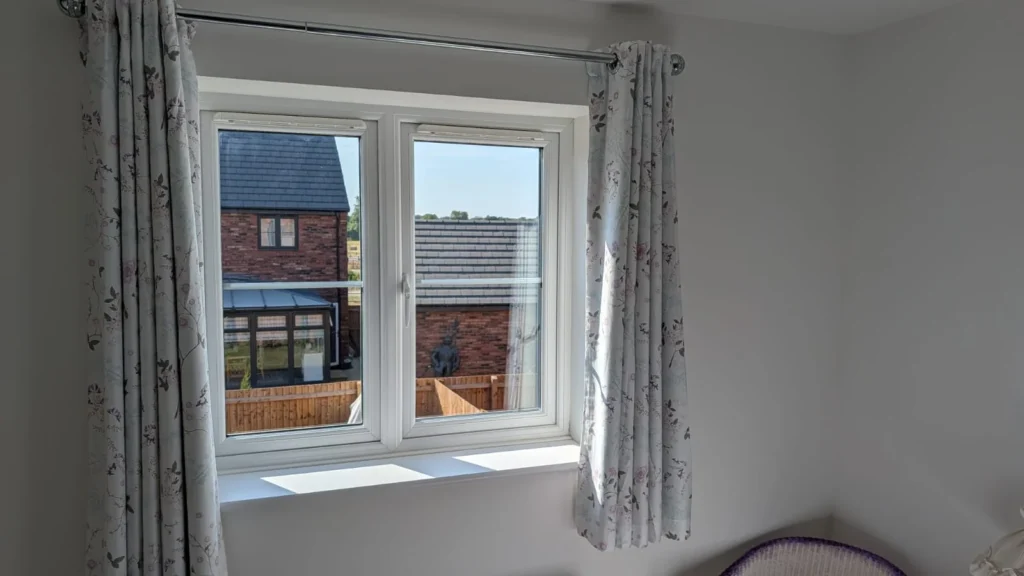 Pale floral made-to-measure curtains before the Venetian blind was fitted