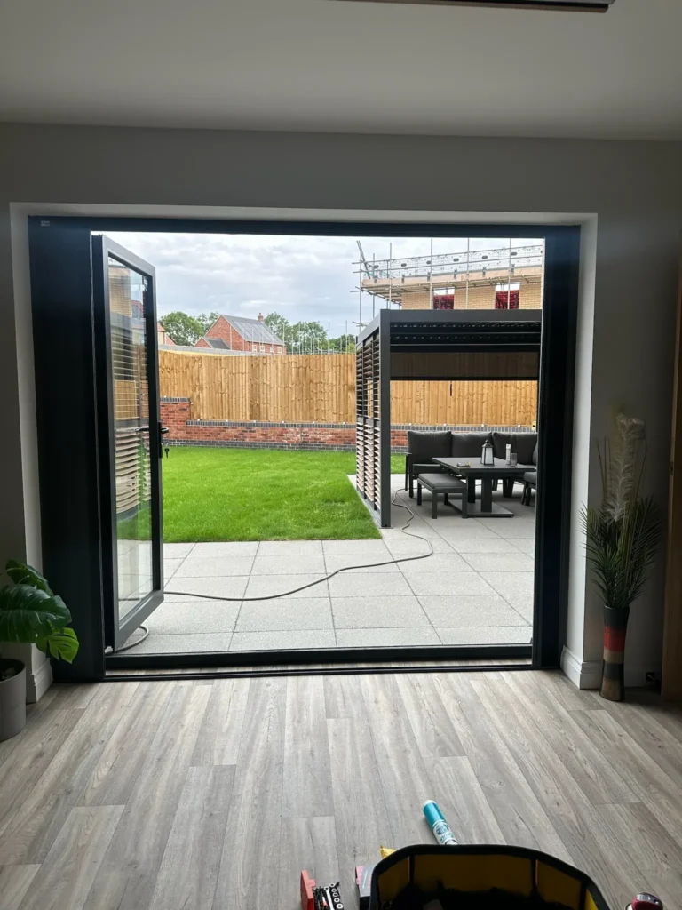 Bifold doors open to the garden with the Blind Screen retracted